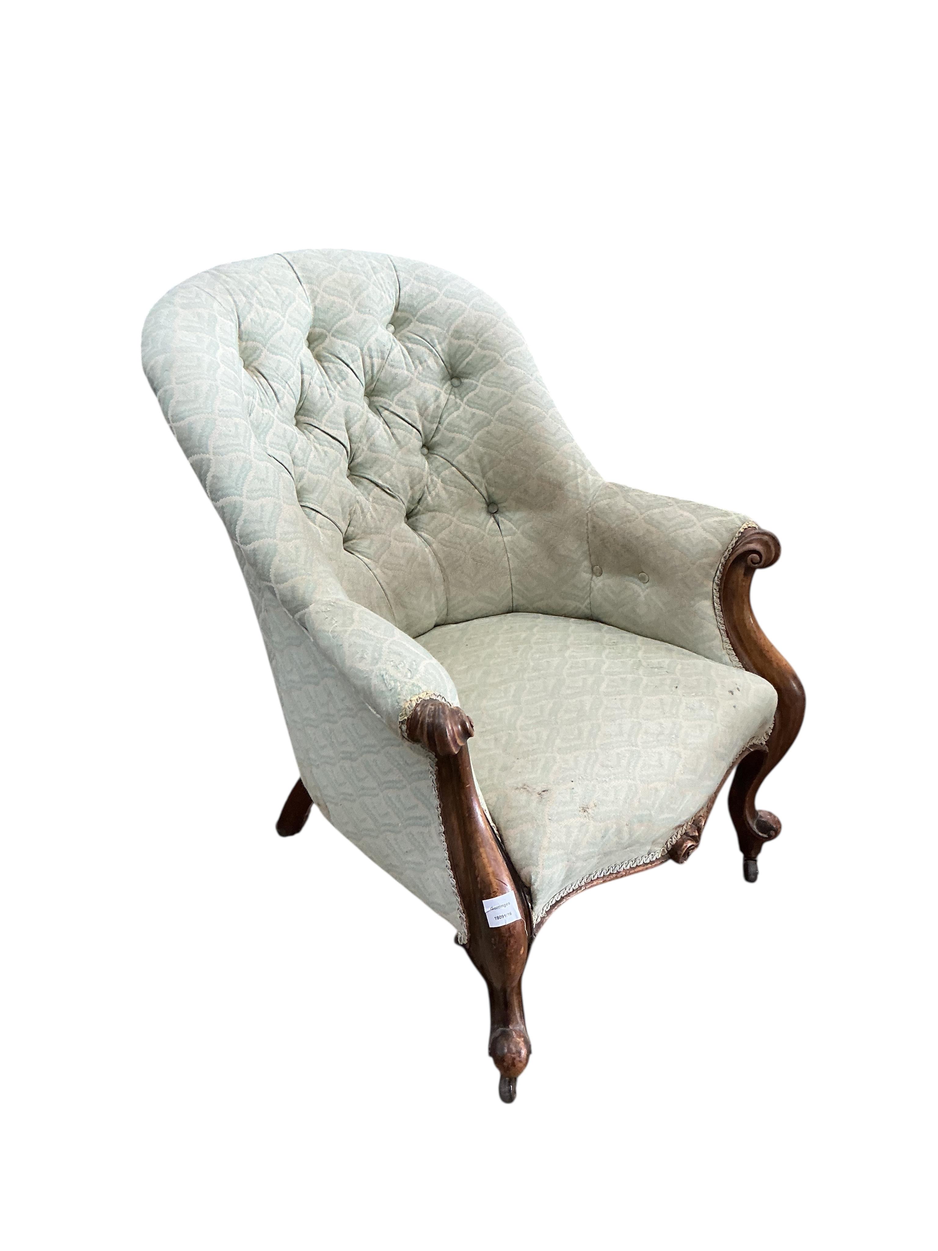 A Victorian mahogany upholstered spoon back armchair, width 72cm, depth 86cm, height 91cm
